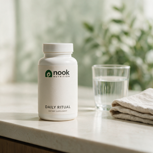 Nook Nutrition Daily Ritual concept bottle beside a glass of water